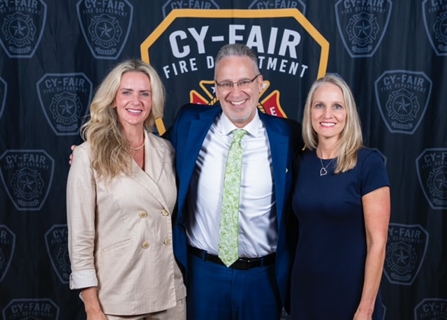Three people at Cy-Fair Fire Department event