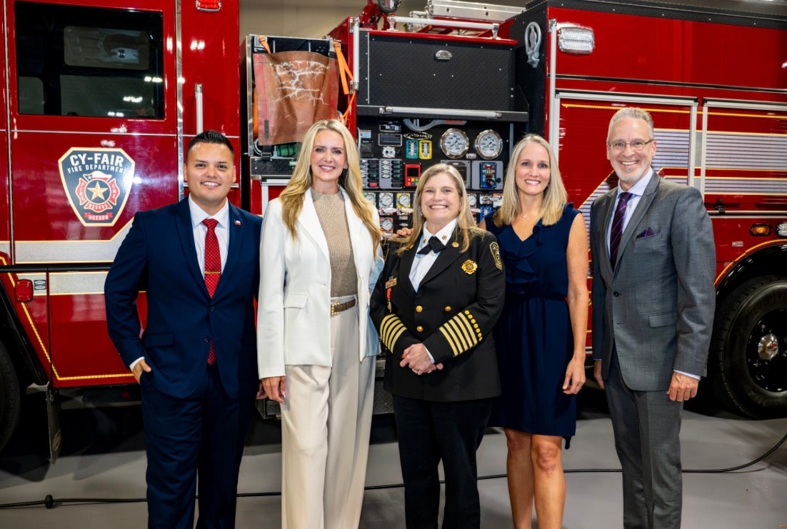 Group photo in front of Gulfair fire truck