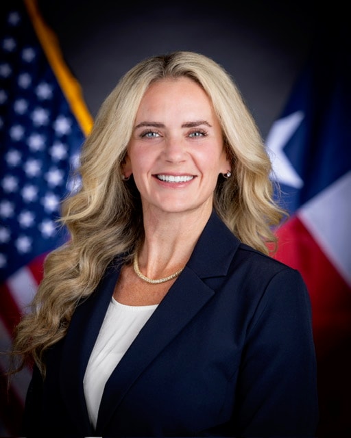 Naressa MacKinnon official portrait with American and Texas flags
