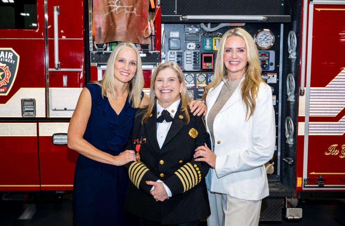 Three women at a fire station event